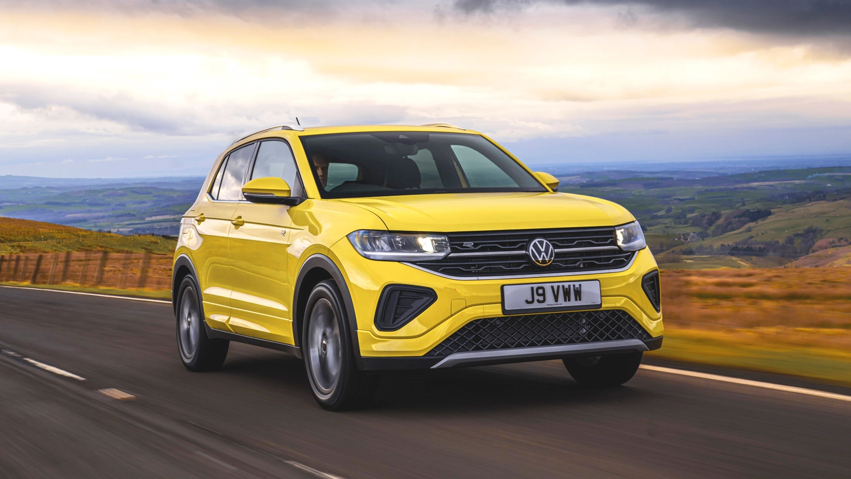 Volkswagen T-Cross yellow dynamic driving side view